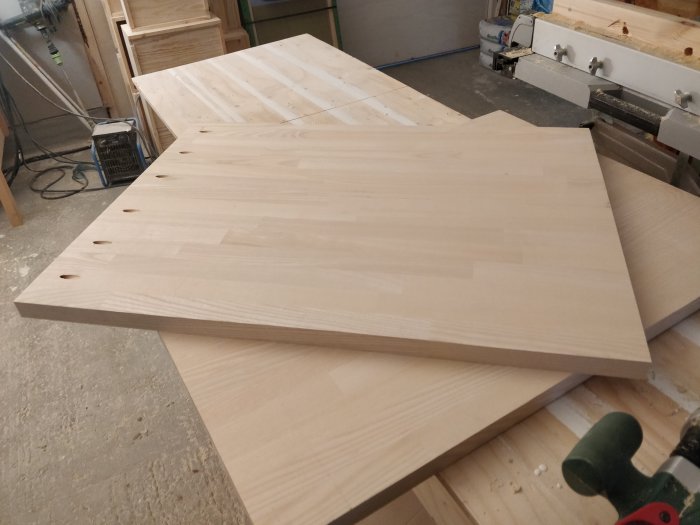 Unfinished wooden countertops made of knot-free ash wood prepared for installation.