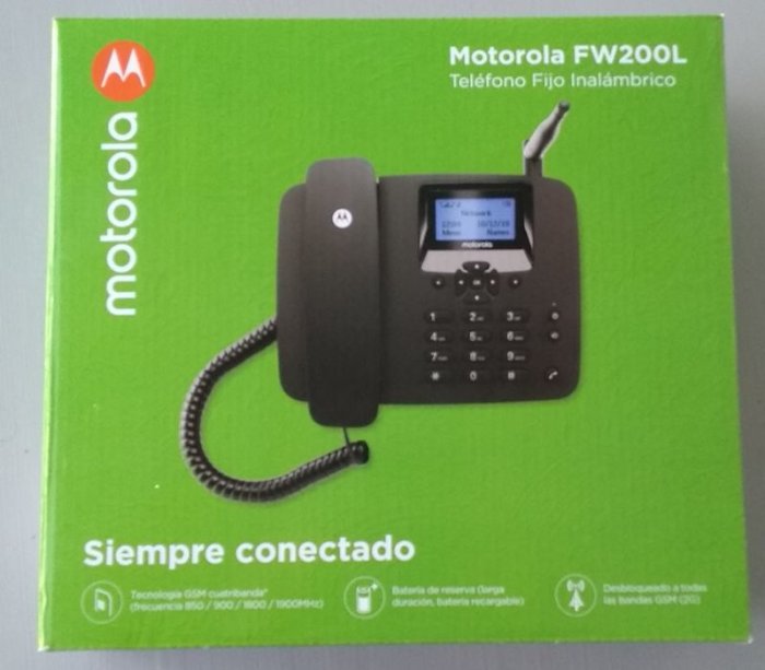 Förpackning av Motorola FW200L fast trådlöst telefon på en grön bakgrund.