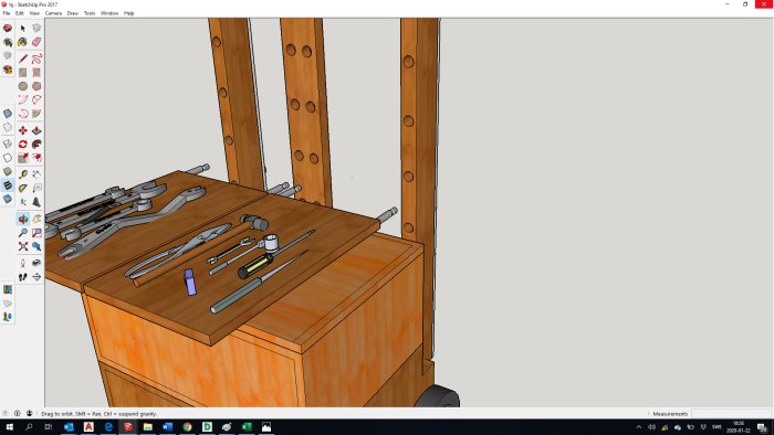 3D-modell av en arbetsbänk med verktyg i SketchUp-programmet.