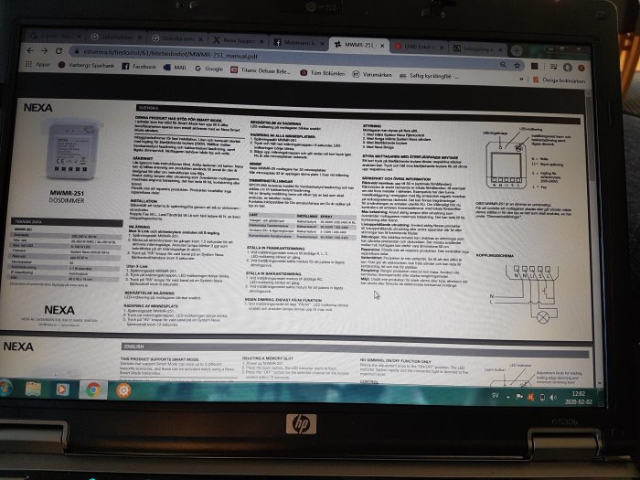 En öppen bruksanvisning för Nexa dimmer på en laptop-skärm med tekniska instruktioner och schema.