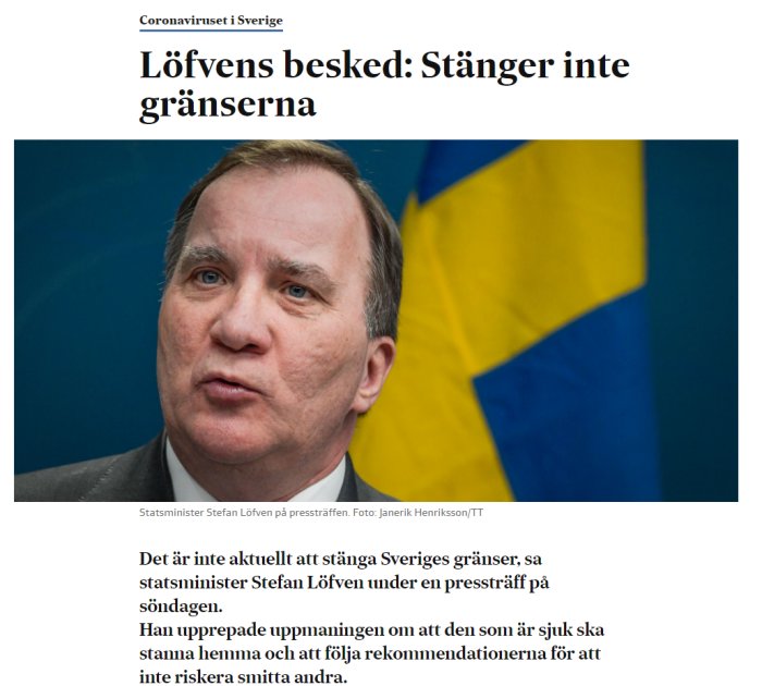 Stefan Löfven med svensk flagga i bakgrunden under presskonferens om att inte stänga gränserna.