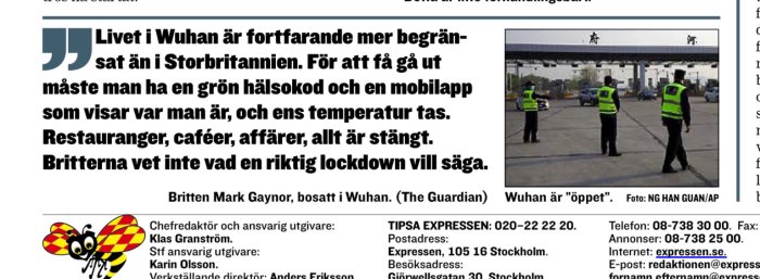 Säkerhetspersonal i västar övervakar trafikplats i Wuhan.