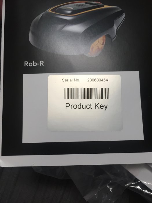 Brochure of a Rob-R robot with a product key label, serial number redacted for privacy.