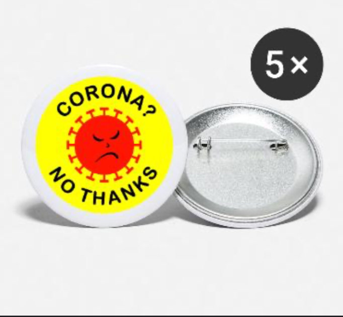 Knappnålar med texten "CORONA? NO THANKS" runt en arg virusillustration.