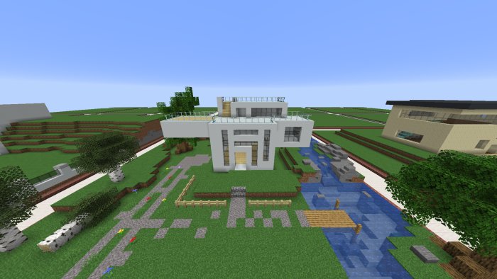Modern villa byggd i ett Minecraft-spel med trädgård och omgivande landskap.