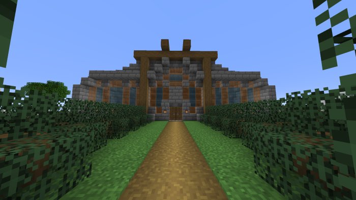 Pixelart av ett hus byggt i ett blockbaserat byggspel med en väg som leder till entrén.