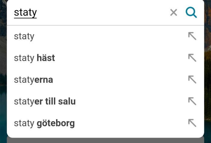 Mobilskärm som visar sökförslag för ordet "staty" i en sökmotor.