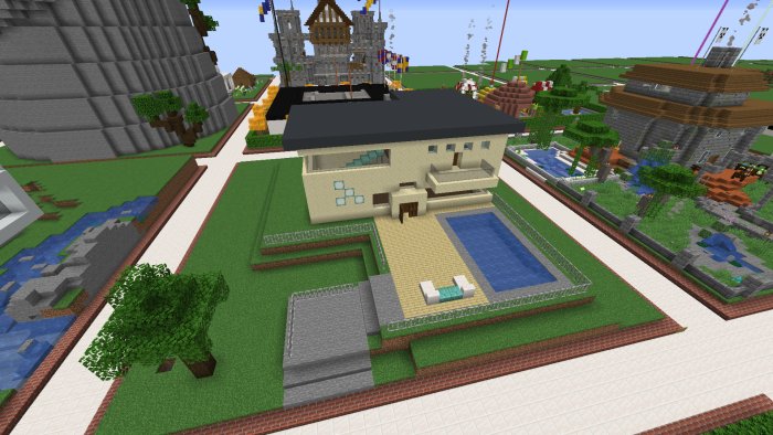 Minecraft-byggprojekt av ett hus med pool och trädgård, omgivet av andra strukturer.