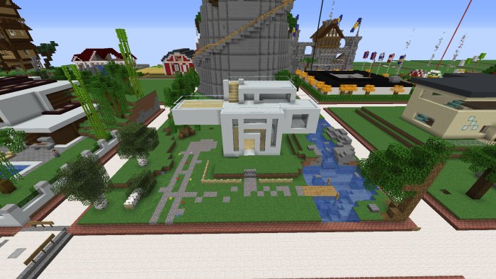 Modern stiliserad byggnad i en Minecraft-värld med trädgård och en väg intill.