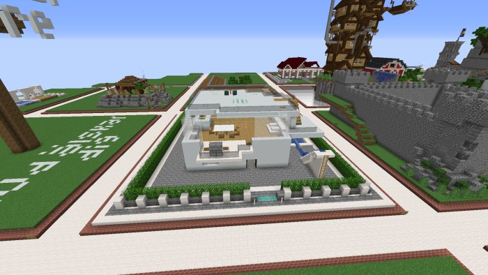 Minecraft-byggprojekt med modernt hus och anlagd trädgård omgivet av andra strukturer.