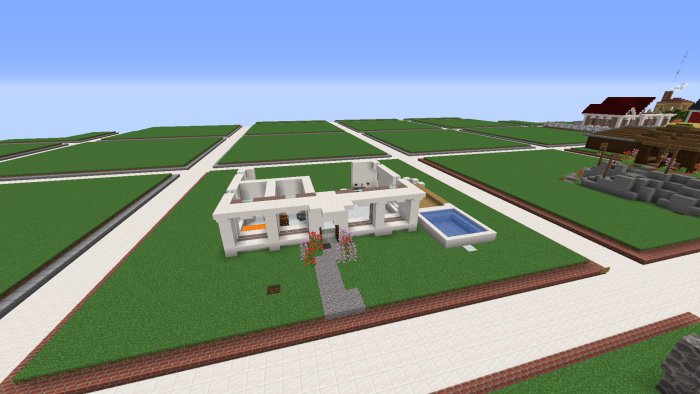 Minecraft-byggprojekt som föreställer ett modernt hus med pool och trädgård.