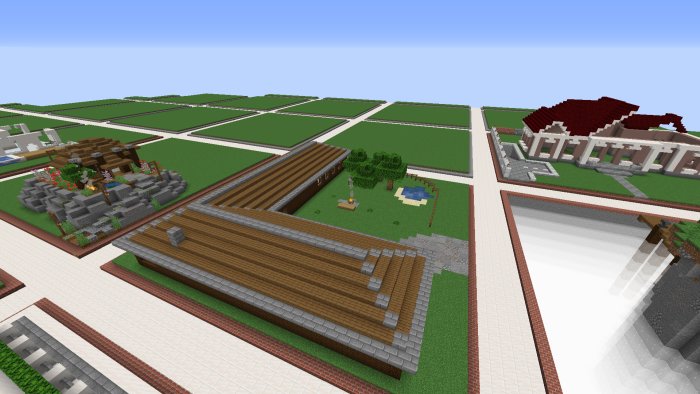 Minecraft-byggprojekt med flera strukturer och landskap, inklusive en halvfärdig romersk byggnad.