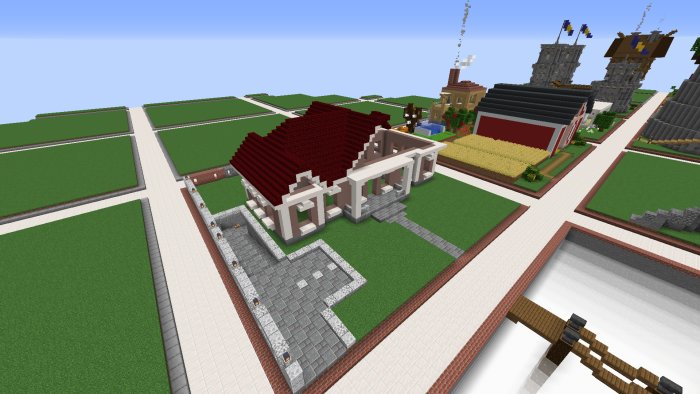 Översiktsbild av en Minecraft-värld med olika byggnader och strukturer som bidrag till en byggtävling.