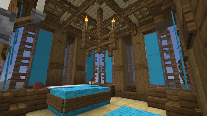 Minecraft inredning med blå säng och träkonstruktioner, fönster som ser ut mot en pixelerad värld.