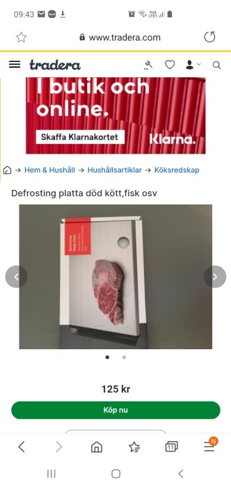 Förpackning med defrosting-platta för upptining av kött med bild av en köttbit.