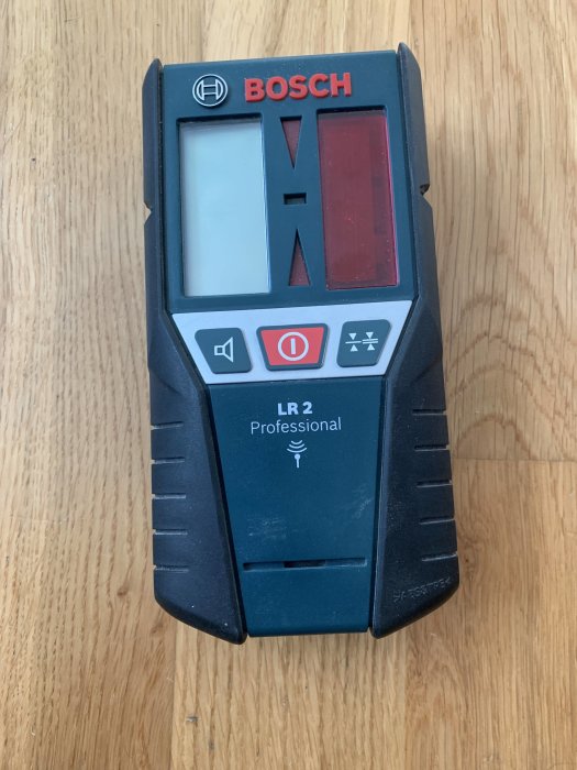 Bosch lasermottagare LR 2 Professional på en träyta, i gott skick.