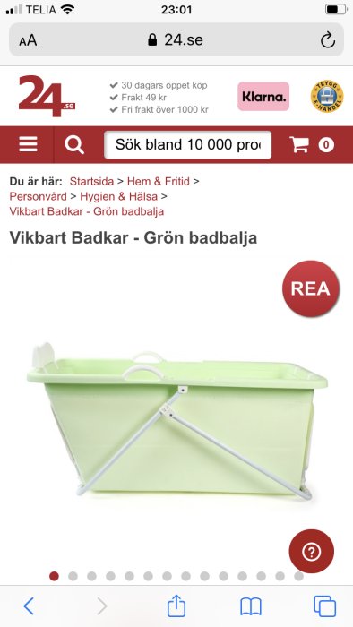 Grön hopfällbar badbalja på en onlinebutiks webbsida, markerad på rea.