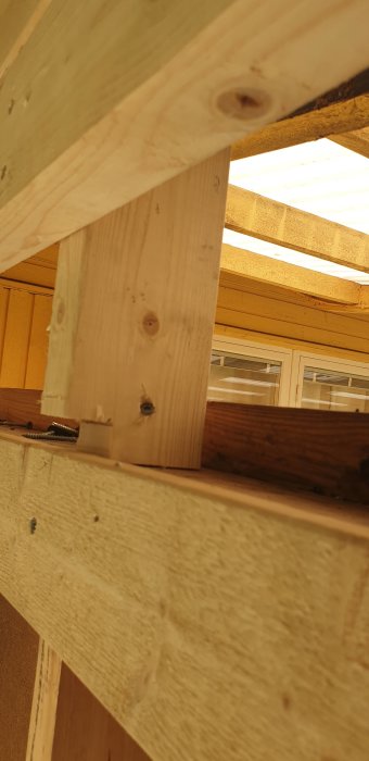 Timber construction with a small section supporting roof weight, possible structural concerns.