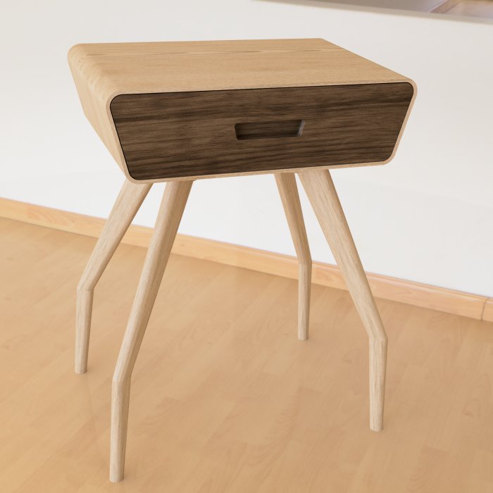 Träbord med omatchande skiv- och benfärger står på ett trägolv.