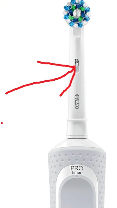 Elektrisk tandborste med indikatorläcka markerad med röd pil.