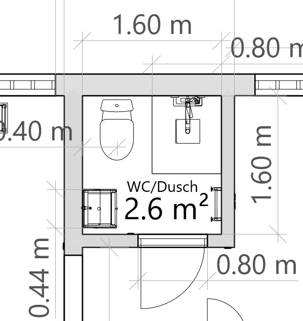 Ritning av ett badrum med måttangivelser, innehåller toalett, handfat och dusch med noterad yta 2.6 m².