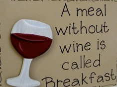 Skylt med texten "A meal without wine is called Breakfast" och bild av ett vinglas.