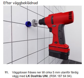 Röd eldriven fräs verktyg håller på att fräsa i en vit kaklad vägg med en blå väggdosa synlig.