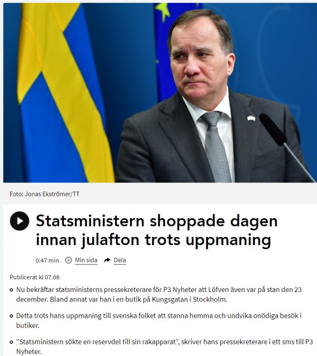 Stefan Löfven står framför svensk och EU-flagga med allvarligt uttryck.