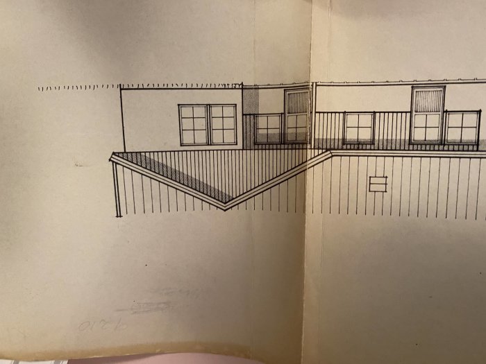 Skiss av byggprojekt som visar exteriören på ett hus och anslutande uterum.