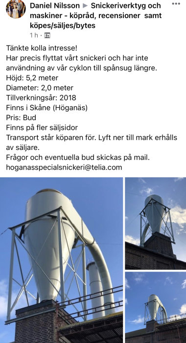 Stor industriell cyklon för spånsug uppförd på byggnadsstruktur, mot blå himmel.