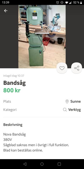 Grön Nova bandsåg på 380V utan sågblad i en verkstadsinställning.