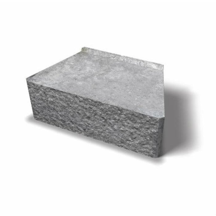 Mursten av typen murblock lämplig för stödmur, grå med yta delvis grov och delvis slät.