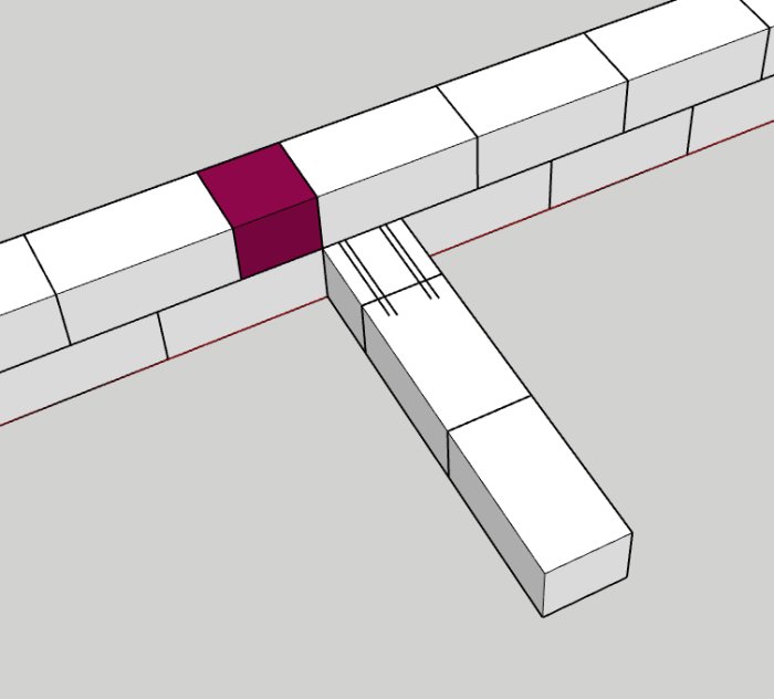 3D-ritning av en källargrund med lecaklossar, rödmarkerad sten och orange skift.