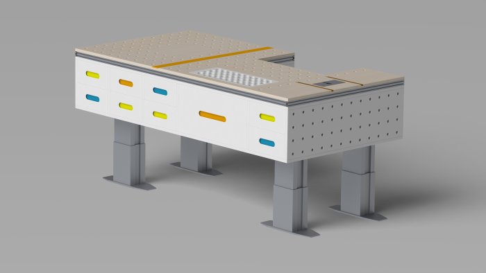 3D-rendering av en arbetsbänk med färgkodade lådor, integrerad styrskena, och dog holes på kortsidan.