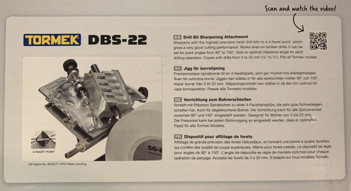 Tormek DBS-22 borrslipningsjigg förpackning med detaljerad beskrivning på flera språk och QR-kod.