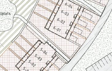 Del av en detaljplan som visar upplåtna markområden med numrerade tomter och omgivande vägar.