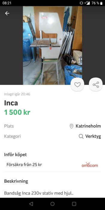 Inca bandåg modell 230v på ett stativ med hjul, placerad i ett verkstadsutrymme med diverse verktyg i bakgrunden.