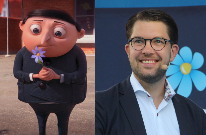 Animerad karaktär med blomma bredvid verklig man i kostym, båda med glada uttryck.