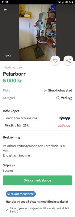 Välfungerande pelarborr i en verkstad med röd arbetsplatta, prissatt till 5000 kr.