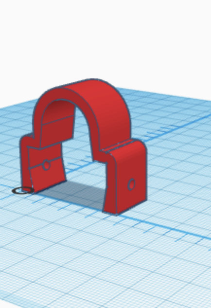 3D-CAD-modell av en röd klammer för montering av kabelskyddsplåt.