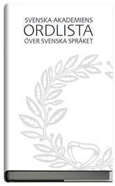 Omslaget till "Svenska Akademiens ordlista" med dekorativt bladmotiv.