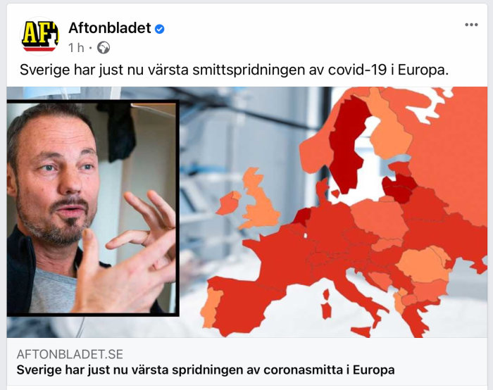 Man gestikulerar framför Europakarta som visar COVID-19 spridningsnivåer.