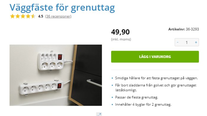 Väggfäste med två grenuttag på en vit vägg bredvid en bordskant.