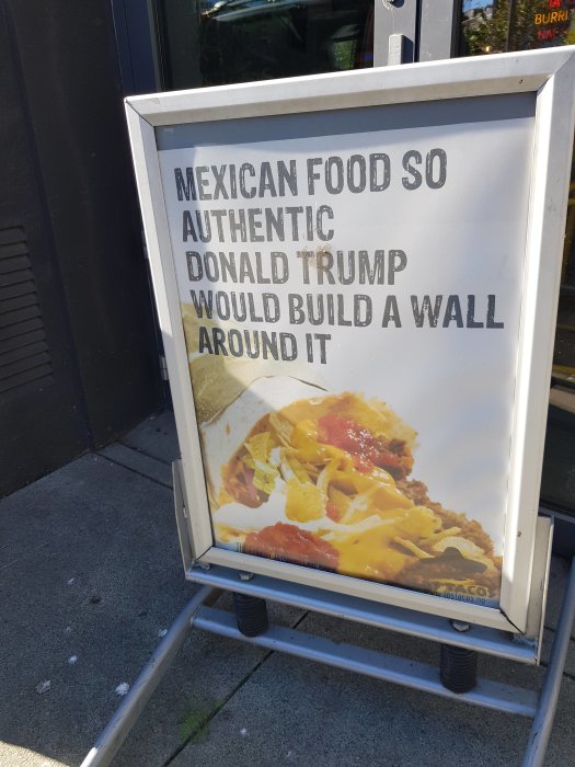 Reklamskylt för mexikansk mat med texten "So Authentic Donald Trump Would Build a Wall Around It".
