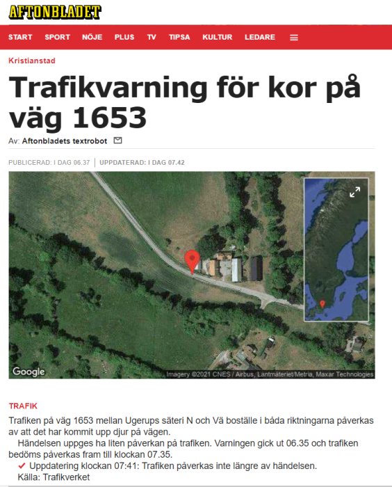 Satellitbild på en väg med markör för trafikvarning för kor på väg 1653.
