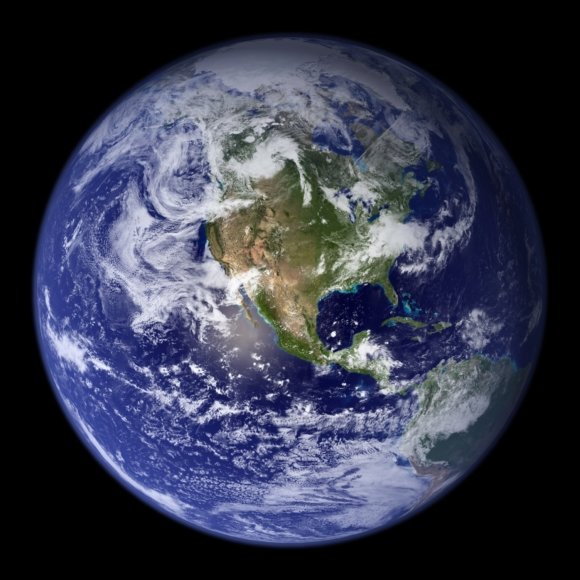 Jorden sedd från rymden med tydliga kontinenter och moln, symboliserar planetära gränser.