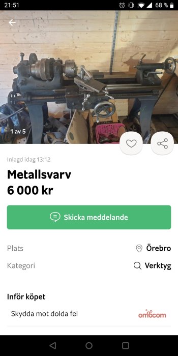 En metallsvärv i en verkstad mot en trävägg, annonserad till försäljning.