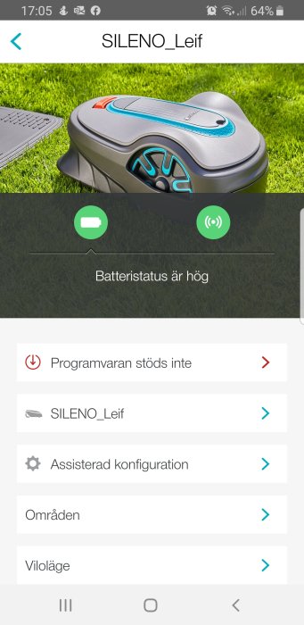 Robotklippare på gräsmatta med appfelmeddelande "programvaran stöds inte" på en smartphone-skärm.