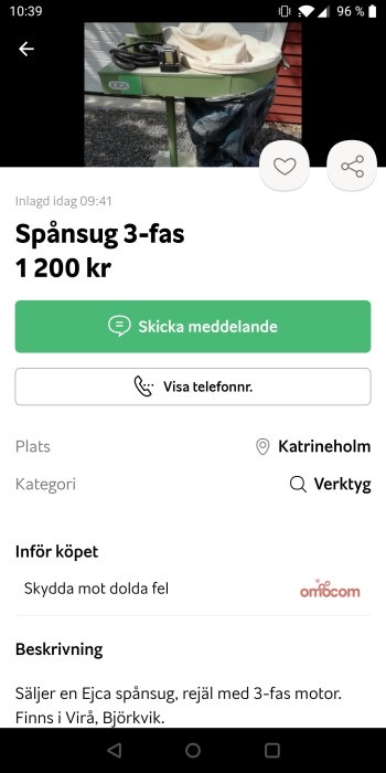 En grönmålad spånsugsmaskin med påse och elektriska kablar, utlagd till försäljning.