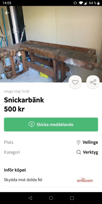 Använd begagnad snickarbänk i trä med skruvstäd, placerad i ett garage.